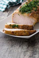 Roasted pork on wooden table
