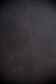 Rusty brown concrete stone background texture. Vertical.