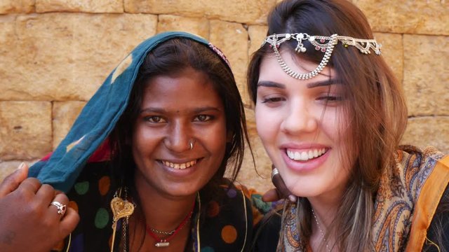 Tourist taking photos with Rajasthani tradicional woman, Jaisalmer, India