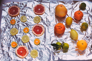 Citrus fruit whole and sliced.