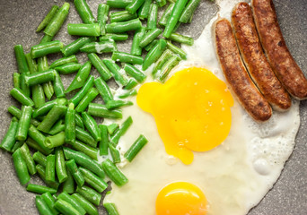 green beans with eggs and sausages