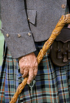 Traditional Scottish kilt and tweed jacket sporran and stick at the Braemar Royal Highland Gathering, the Braemar Games in Scotland