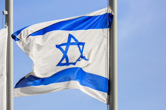 Blue and white flag of Israel on wind