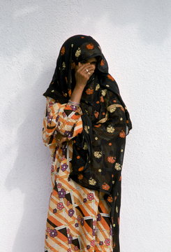 Shy young girl modestly dressed in Muscat in Oman