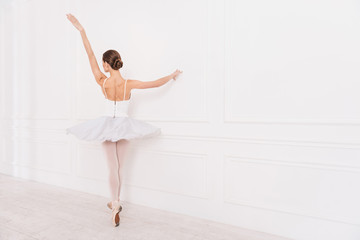 Elegant female standing in ballet position