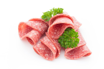 Salami sausage slices isolated on white background.