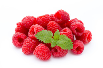 Ripe red raspberries isolated on white background.