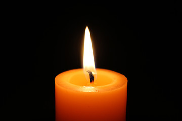 orange burning candle