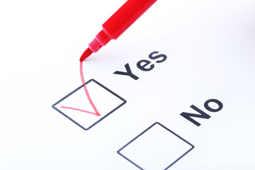 Check boxes yes and no on white paper
