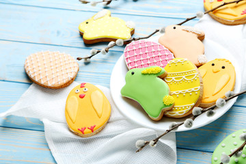 Colorful easter cookies on blue wooden background