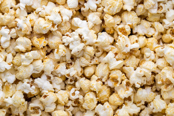 Popcorn background. Caramel sweet corn. Cinema snack.