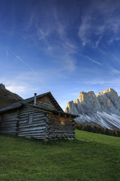 The early morning light illuminates Malga Zannes and the Odle in background, Funes Valley, South Tyrol, Dolomites