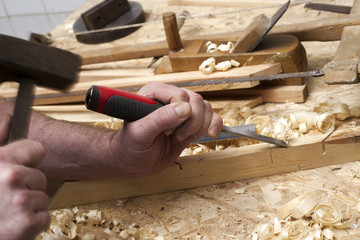 carpenter working,hammer,meter and screw-driver on construction