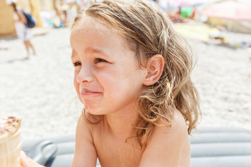 Fototapeta premium Little boy eating an ice cream