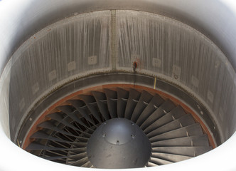 Aircraft jet engine. Closeup shot. Blades are numbered. Huge size.