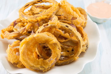 beer battered onion rings close up