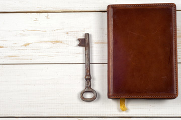 old keys on book, antique wood background