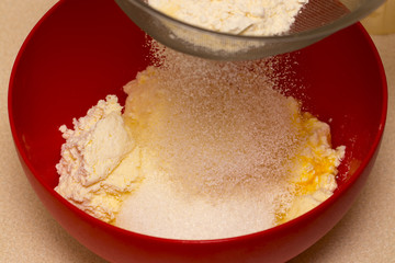 Flour sifting through a sieve for a baking