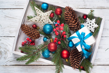 Christmas background. Blue red decorations gift cones at white b