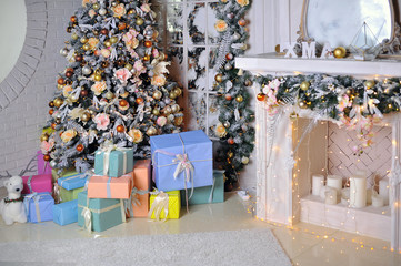 Beautiful Christmas Christmas living room interior with decorated Christmas tree, fireplace, gifts, Teddy bear toy and a chair. Cards. Background. Elements.
