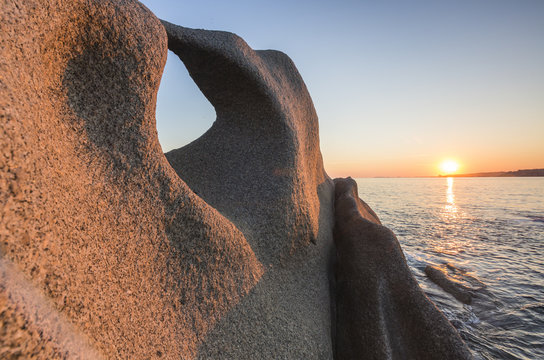 Sunset on the unusual shaped cliffs and blue sea, Capo Testa, Santa Teresa di Gallura, Province of Sassari, Sardinia, Mediterranean