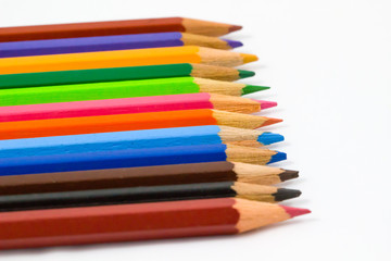 Fototapeta premium Colored pencils / Colour pencils isolated on white background close up / colored pencils / Colorful wooden Colored pencils on white background / Colorful wooden Colored pencils