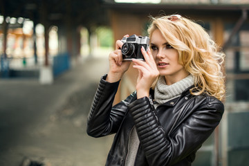 Pretty young woman at a train station