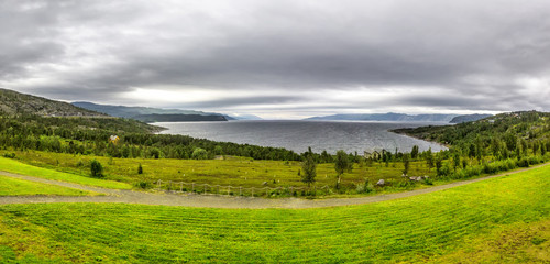 Fototapeta na wymiar Scandinavian northern nature. Beautiful view on Jiepmaluokta bay in the municipality of Alta in Norway. In Sami language the name Jiepmaluokta is 