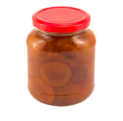 Apricot jam in a glass jar isolated on white background