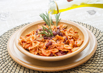 earthenware pot with Italian pasta with red kidney beans