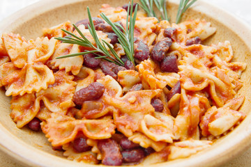 earthenware pot with Italian pasta with red kidney beans