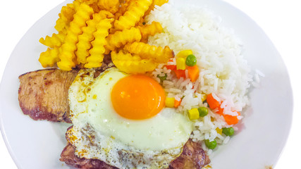 Fried egg with rice and french fries,grilled steak.