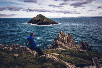 The rumps cornwall england uk, with female walker, hiker rambler. Set in the fantastic landscape...