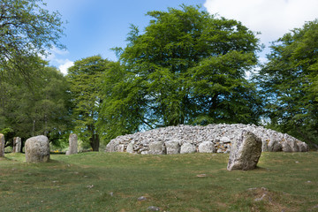 Inverness, Scotland - June 2, 2012: The menhir stone circle and grave site heap of gray stones at...