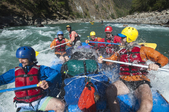 Rafters get splashed as they go through some big rapids on the Karnali River in Nepal