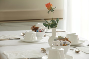 Table for breakfast in white