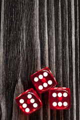 risk concept playing dice at dark wooden background top view