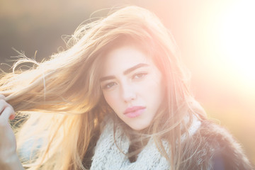 Pretty girl with knitted scarf