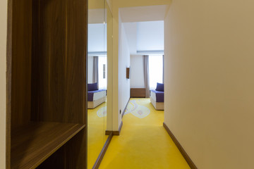 Corridor with closet in hotel room