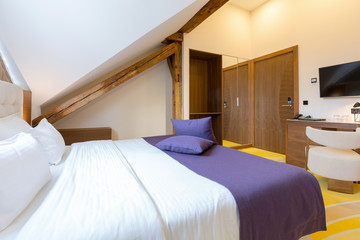 Interior of a luxury hotel bedroom in the attic