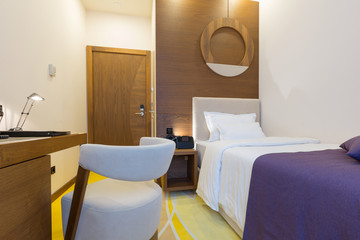 Single bed hotel room interior