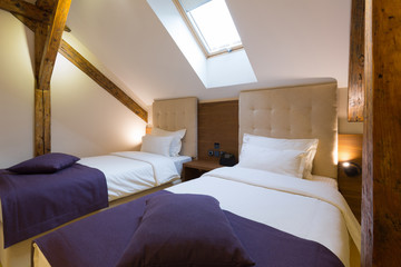 Hotel bedroom interior in the loft apartment