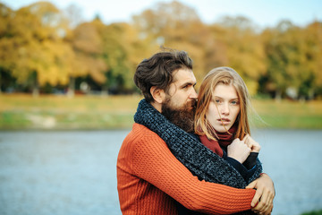 Fototapeta premium Young couple in autumn park