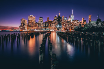 Lower Manhattan skyline night view from Brooklyn Bridge Park in New York City.