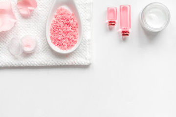 organic cosmetic with rose oil on white background top view