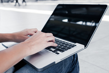 Closeup of person using laptop. 