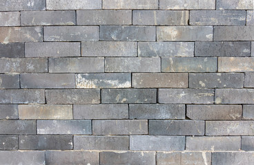grey brickwall with sunlight