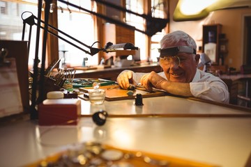 Horologist repairing a watch in the workshop