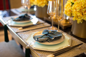 elegant crockery on dining table in modern dining room