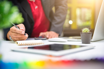 Businessman making presentation on office table with smart phone